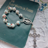 White ond decade rosary.